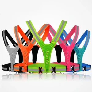 Six Running LED Vests USB Charging High Visibility Reflective Safety Running Lights in black, orange, yellow, green, blue, and pink are shown upright in a row with adjustable straps and reflective strips against a white background.