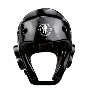 A black Revolution Sparing HeadGuard featuring "Revolution Taekwondo" and a lion logo on the front, displayed against a white background.