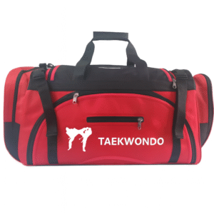 The Tae Kwon Do Red Sparing Bag is a red and black sports duffel with handles and zippers, featuring "TAEKWONDO" and a white silhouette of a kicking martial artist printed on the front.